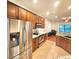 Modern kitchen with stainless steel appliances and hardwood floors at 1720 Crocker Ave, Orlando, FL 32806