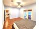 Main bedroom with hardwood floors and access to screened patio at 1720 Crocker Ave, Orlando, FL 32806