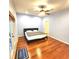 Spacious main bedroom with hardwood floors and sliding doors to patio at 1720 Crocker Ave, Orlando, FL 32806