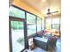 Cozy screened patio with seating area, perfect for relaxing at 1720 Crocker Ave, Orlando, FL 32806