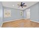 Bright bedroom with hardwood floors and ceiling fan at 206 Albrighton, Longwood, FL 32779