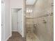 Large walk-in shower with glass enclosure and beige tile at 2197 Loblolly Bay St, Clermont, FL 34711