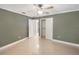 Simple bedroom with neutral walls and shiny tile floors at 2410 Sanford Ave, Sanford, FL 32771