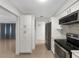 Modern kitchen with white cabinets and stainless steel appliances at 2410 Sanford Ave, Sanford, FL 32771
