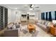 Bright living room with comfy seating and a view of the kitchen at 2410 Sanford Ave, Sanford, FL 32771