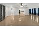 Open concept living room and kitchen with shiny floors and ceiling fan at 2410 Sanford Ave, Sanford, FL 32771