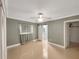 Spacious main bedroom with neutral walls, shiny floors and ceiling fan at 2410 Sanford Ave, Sanford, FL 32771