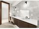 Modern bathroom with double vanity and marble tile at 2661 Via Tuscany, Winter Park, FL 32789
