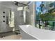 Contemporary bathroom with soaking tub and glass enclosure at 2661 Via Tuscany, Winter Park, FL 32789