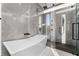 Spa-like bathroom featuring a free-standing tub and a walk-in shower at 2661 Via Tuscany, Winter Park, FL 32789