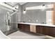 Modern bathroom with double vanity, large glass shower, and soaking tub at 2661 Via Tuscany, Winter Park, FL 32789