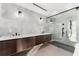 Elegant bathroom featuring double vanity and glass shower at 2661 Via Tuscany, Winter Park, FL 32789