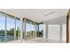 Bedroom with large windows offering scenic outdoor views at 2661 Via Tuscany, Winter Park, FL 32789
