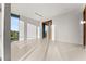 Sunlit bedroom with sliding doors and tranquil views at 2661 Via Tuscany, Winter Park, FL 32789