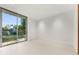 Light-filled bedroom with sliding glass doors to deck at 2661 Via Tuscany, Winter Park, FL 32789