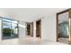 Modern bedroom with ensuite bathroom and pool view at 2661 Via Tuscany, Winter Park, FL 32789