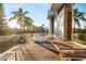 Private deck with glass railings and outdoor seating at 2661 Via Tuscany, Winter Park, FL 32789