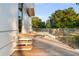 Elevated wooden deck with glass railings and tranquil backyard views at 2661 Via Tuscany, Winter Park, FL 32789