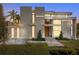 Modern home with sleek design, light color, and a landscaped lawn at 2661 Via Tuscany, Winter Park, FL 32789
