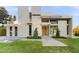 Contemporary home showcasing a clean design and manicured landscaping at 2661 Via Tuscany, Winter Park, FL 32789