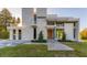 Modern home with wood front door and landscaping at 2661 Via Tuscany, Winter Park, FL 32789