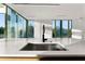 Modern kitchen with island and stainless steel sink at 2661 Via Tuscany, Winter Park, FL 32789