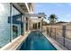 Modern rectangular pool with spa and safety fence at 2661 Via Tuscany, Winter Park, FL 32789