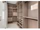 Bright walk-in closet with plenty of shelving and hanging space at 2661 Via Tuscany, Winter Park, FL 32789