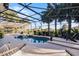 Inviting pool area with screened enclosure and hammock at 2781 Tree Meadow Loop, Apopka, FL 32712