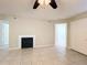 Bright living room with tile floors, fireplace, and ceiling fan at 375 Lake Ontario Ct # 102, Altamonte Springs, FL 32701