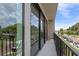 Private balcony overlooking tree-lined street at 42 W Harding St # F, Orlando, FL 32806