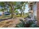 Backyard view with large trees and patio area at 5417 Lake Margaret Dr # G, Orlando, FL 32812