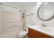 Clean bathroom with tub, shower, and wood vanity at 5417 Lake Margaret Dr # G, Orlando, FL 32812