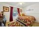 Bedroom with floral bedding and red curtains at 5417 Lake Margaret Dr # G, Orlando, FL 32812
