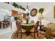 Charming dining area with a table, chairs, and a view into the kitchen at 5417 Lake Margaret Dr # G, Orlando, FL 32812