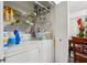 Laundry closet with washer, dryer, and shelving at 5417 Lake Margaret Dr # G, Orlando, FL 32812