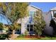 Two-story house with gray siding, landscaping, and a walkway at 8311 Lookout Pointe Dr, Windermere, FL 34786