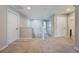 Upstairs hallway with carpeted floor and doors to bedrooms and bathroom at 10181 Armando Cir, Orlando, FL 32825