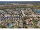 Aerial view of neighborhood showing a house with a pool at 10227 Cypress Knee Cir, Orlando, FL 32825