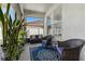 Relaxing screened porch with wicker furniture and a blue rug at 10227 Cypress Knee Cir, Orlando, FL 32825