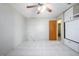 Bedroom with tile flooring, ceiling fan, and built-in closet at 1044 Mosshart Ln, Orlando, FL 32825