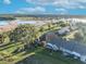 Aerial view of a house and surrounding community near a lake at 1162 Villa Ln # 109, Apopka, FL 32712