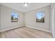 Bright bedroom featuring new wood-look flooring at 1310 Temple Cir, Haines City, FL 33844