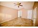 Spacious bedroom with tile floors and ceiling fan at 1326 Dunbarton Ct, Kissimmee, FL 34758