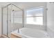 Relaxing bathroom with soaking tub and a separate shower at 14643 Tanja King Blvd, Orlando, FL 32828