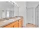 Bathroom boasts double sinks, wood cabinets, and a shower at 14643 Tanja King Blvd, Orlando, FL 32828