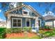 Curb appeal! Blue house with white trim, well-manicured lawn at 14643 Tanja King Blvd, Orlando, FL 32828