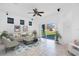 Spacious Gathering room featuring tile floors, sliding glass doors to backyard, and ceiling fan at 14643 Tanja King Blvd, Orlando, FL 32828
