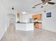 Open kitchen with island and breakfast bar, perfect for entertaining at 14643 Tanja King Blvd, Orlando, FL 32828