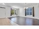 Open concept living and dining area with hardwood floors at 14643 Tanja King Blvd, Orlando, FL 32828